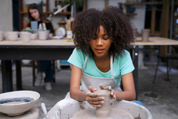 istock Young woman is making pottery as leisure activity. 1425397590