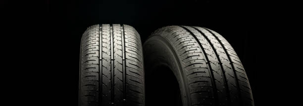 istock Two new summer wheels on a black tire background graphically panoramic photo 1425405979