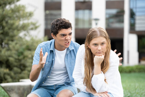 istock Angry and aggressive hispanic boy shouting girlfriend 1425417935