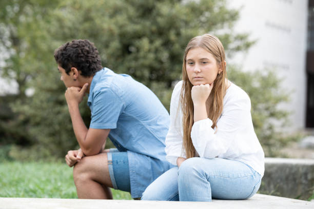 istock Sad couple sitting back to back 1425417956