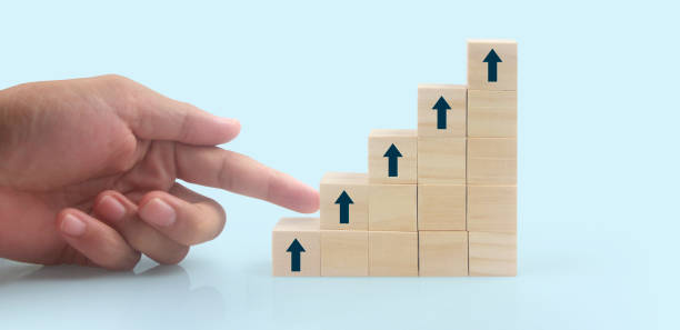 istock Business connecting piece of multi wood chart blocks steps in hand 1425419826