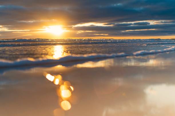 Dreamlike sunrise at the Baltic Sea sandy beach on Rügen near Lobbe stock photo