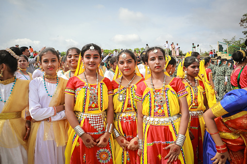 Young girls dressed up in Rajasthani style colorful folk costume for the Indian Independence day cultural event in Mysore, India.