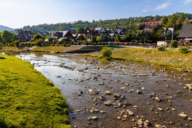 Panorama of Pieniny Mountains over Grajcarek creek in Szczawnica Zdroj springs resort town in Lesser Poland Szczawnica, Poland - August 18, 2022: Panorama of Pieniny Mountains over Grajcarek creek joining Dunajec river in Szczawnica Zdroj springs resort town in Lesser Poland szczawnica stock pictures, royalty-free photos & images