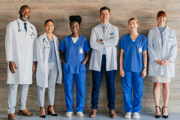 Medical teamwork portrait, hospital collaboration and healthcare expert with doctors, nurses and surgeons together for surgery, medicine help and trust. Diversity clinic, consulting and smile service stock photo