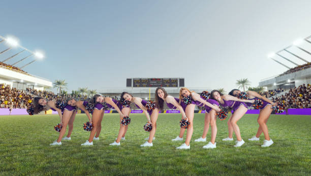 istock Group of cheerleaders in action on  stadium 1425430173