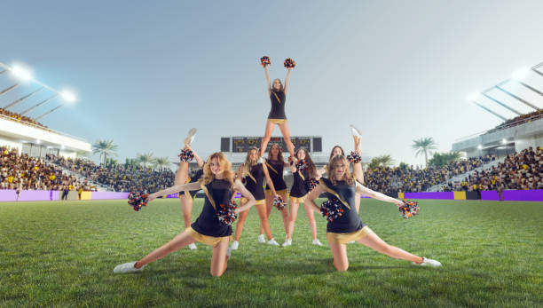 istock Group of cheerleaders in action on  stadium 1425430606