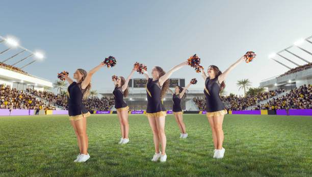 istock Group of cheerleaders in action on  stadium 1425430707
