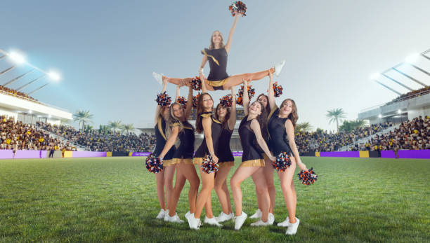 istock Group of cheerleaders in action on  stadium 1425430807