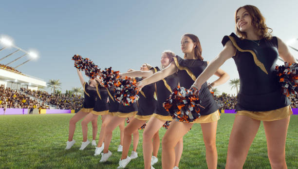 istock Group of cheerleaders in action on  stadium 1425431561