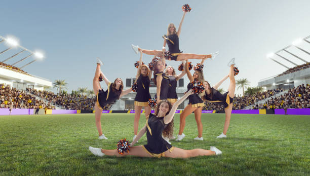 istock Group of cheerleaders in action on  stadium 1425431583