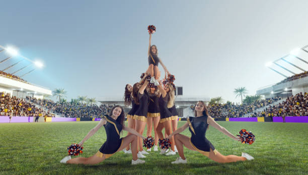 istock Group of cheerleaders in action on  stadium 1425431586