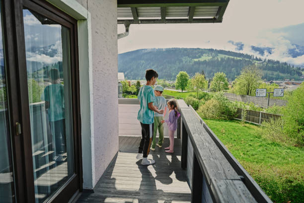 istock Children at the balcony in mountain Austria. 1425432031