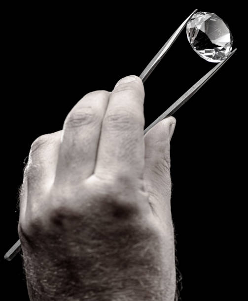 istock Large gemstone in jeweler's hand close up. Gem identifying and evaluating process. 1425432477