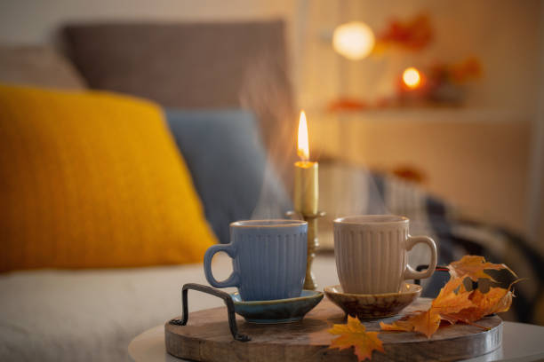 istock two  cups with hot drinks at home with autumnal decor 1425435115