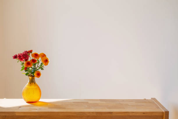 istock chrysanthemums in glass vase on white background 1425435206