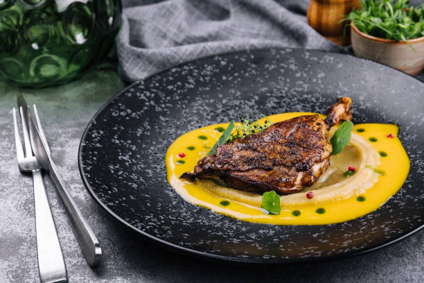 istock Roast duck leg with mashed green vegetables 1425436918