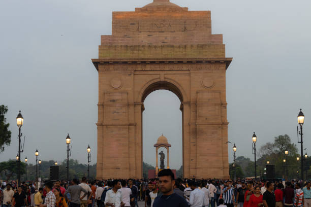 Crowd of tourists at India Gate, Part of redeveloped Central Vista Avenue and Open for Public, Marked End Of British Colonialism Era. stock photo