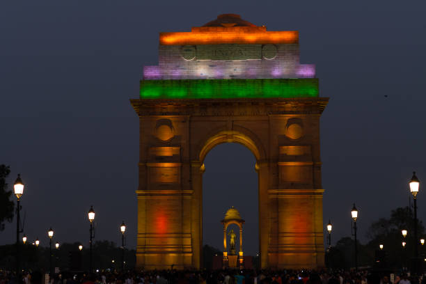 Crowd of tourists in the evening at Tri color illuminated India Gate part of redeveloped Central Vista stretch in Delhi stock photo