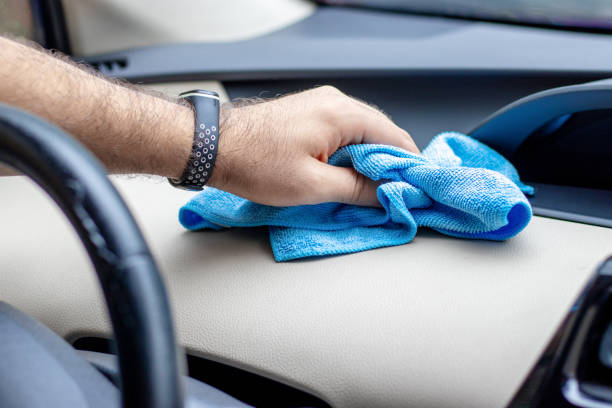istock hand cleaning car interior with microfiber cloth and spray 1425438605
