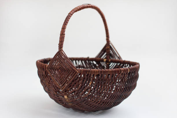 istock empty wicker basket made of vines on a white background. Easter Item 1425445181