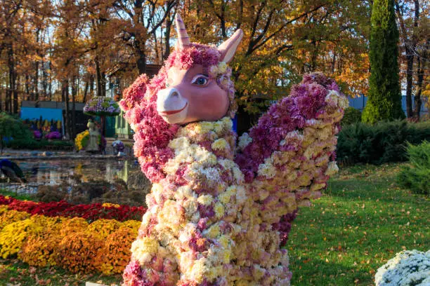 Photo of Unicorn made of chrysanthemums in a park at autumn