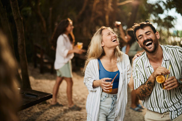 istock Cheerful couple having fun during spring party in nature. 1425447058
