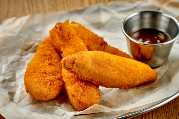 istock Breaded chicken nuggets. A selective trick. Close-up. Noise added in post-production 1425455024