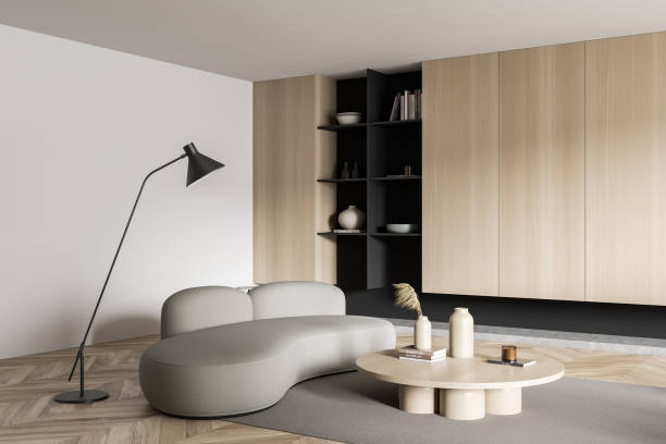 istock Light living room interior with couch and shelf with decoration. Empty wall 1425461888