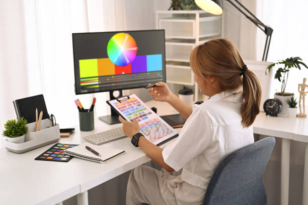 istock Creative woman working with color palette, choosing color samples for design project at modern graphic studio. 1425463171