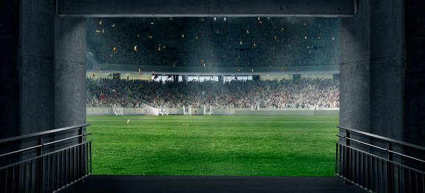 サッカー場に通じるスタジアムトンネル。選手、アスリートはファンでいっぱいの照らされたサッカースタジアムに入場します。デジタル3dモデル - トリビューンタワー ストックフォトと画像