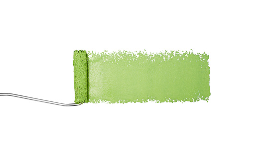 Paint roller painting green stripe isolated on a white background.