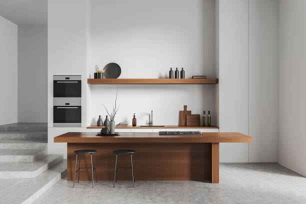 istock Light kitchen interior with bar island, kitchenware and art decoration 1425465096