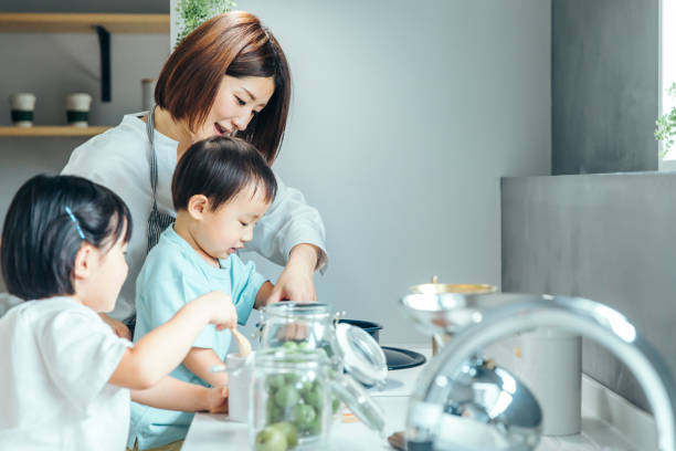 istock Parent and child cooking in the kitchen 1425465849