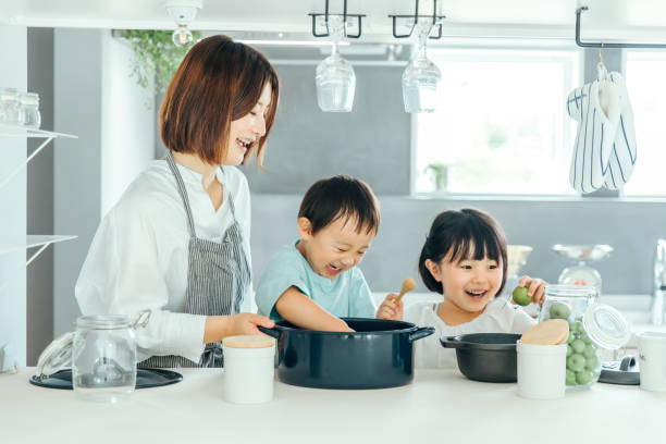 istock Parent and child cooking in the kitchen 1425465893