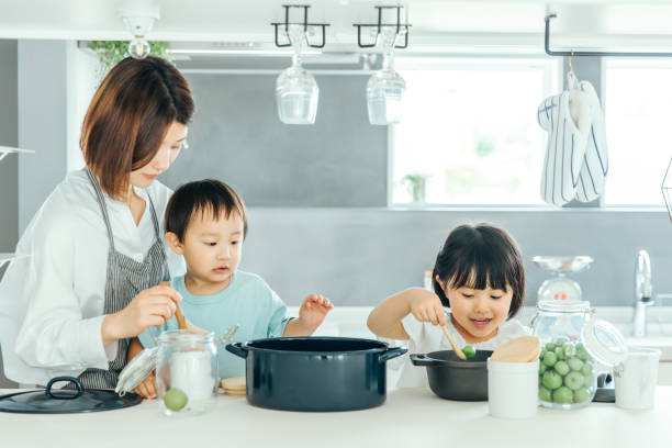 istock Parent and child cooking in the kitchen 1425465911