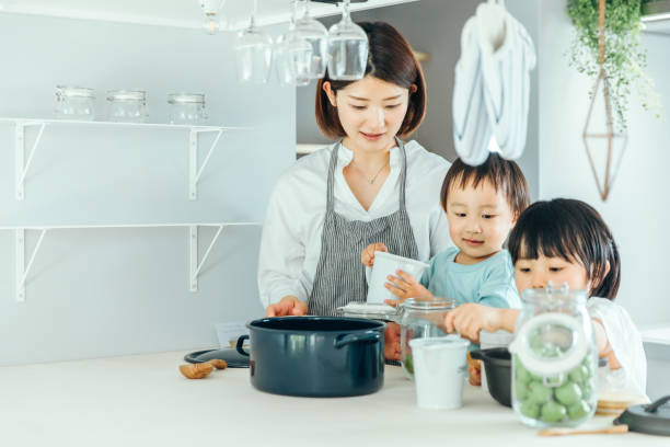 istock Parent and child cooking in the kitchen 1425465936