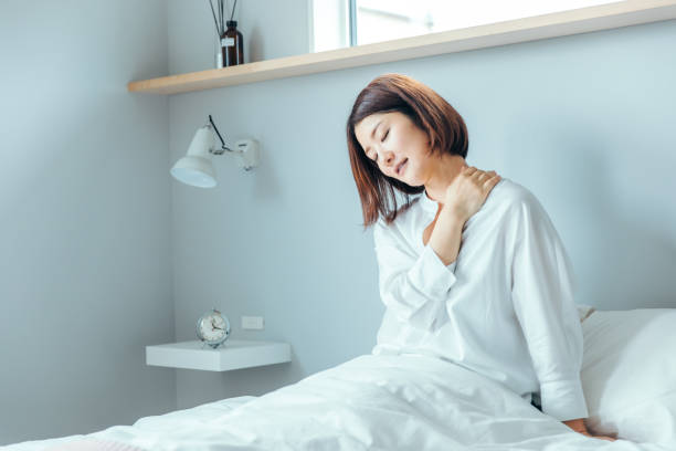 istock woman rubbing her shoulder 1425466145