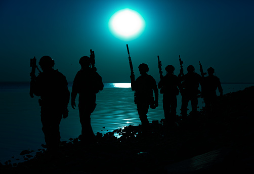 Army soldiers with rifles moon night silhouette