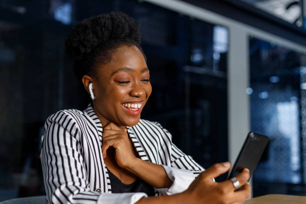istock Happy woman video calling on smartphone in office 1425466570