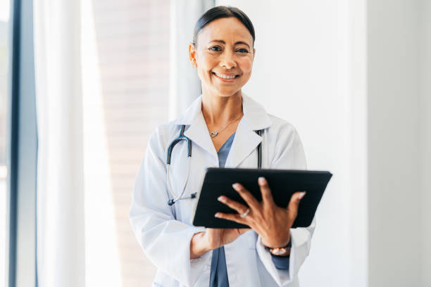 Telehealth doctor woman, connect digital tablet and virtual healthcare analysis, medical service and planning online. Happy portrait of wellness worker, medicine research and clinic internet results stock photo