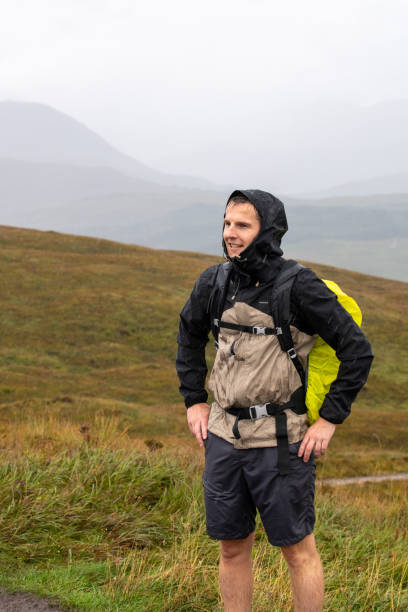 istock Hiker in the Scottish highlands. Wearing raincoat. 1425475462