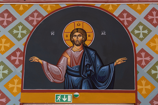Iisalmi, Finland - June 7, 2022: Painting of Jesus in Hotel Golden dome an old orthodox church in Iisalmi in Savonia in Finland