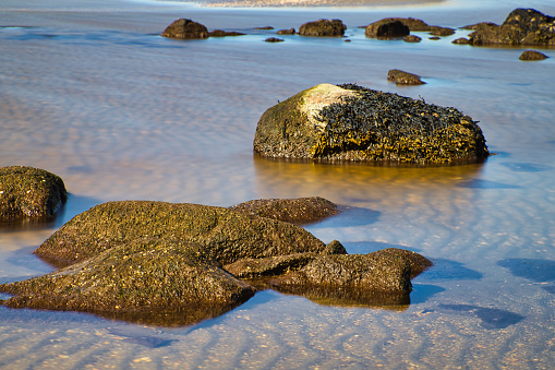 Long exposure of waves and rocks captured at Ugglarp Vesslunda Naturreservat at coast of Sweden