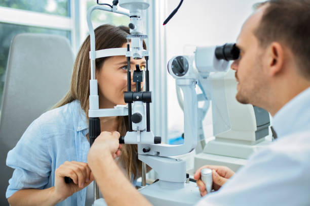 Eye exam Doctor and patient in ophthalmology clinic eye test equipment stock pictures, royalty-free photos & images