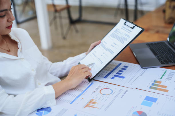 istock female business owner reading important documents before signing 1425487624