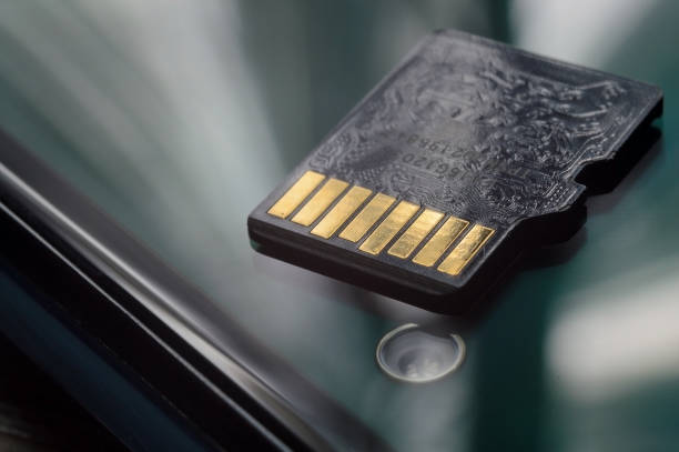 istock micro sd card lies on the smartphone screen. close-up. 1425489562