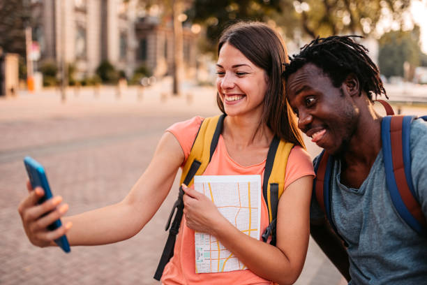 istock Tourist couple taking selfies on town square 1425490937