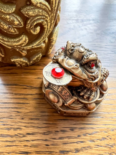istock Feng Shui lucky money frog with coin 1425491432