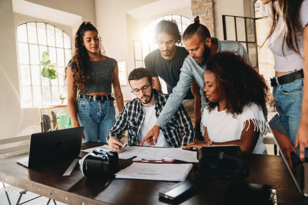 istock Group of creatives working together at a new project 1425491800